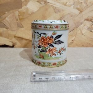 Floral Tin with Orange and Green Accents